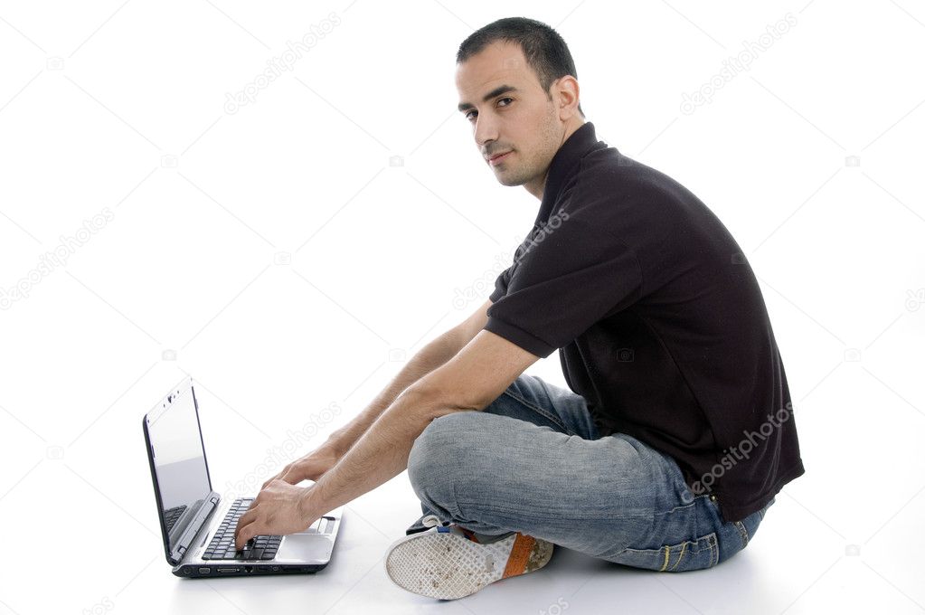 Handsome male busy with laptop