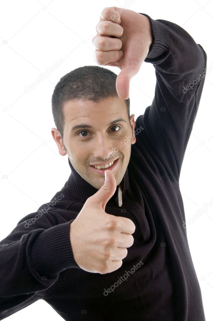 Young guy with thumbs up and down — Stock Photo © imagerymajestic #1656211