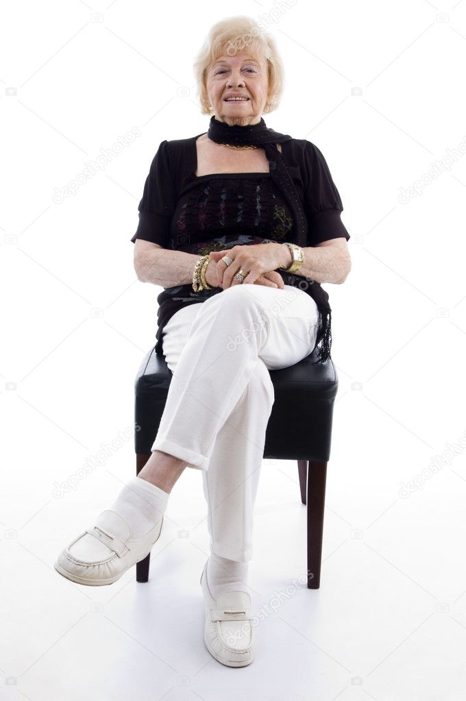 Old woman sitting on chair and relaxing