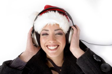 Happy female listening music clipart