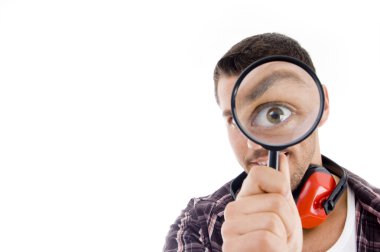 Man looking through magnifying glass clipart