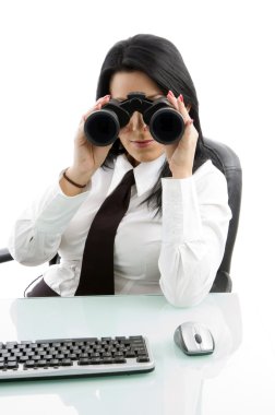 Female manager looking through binocular clipart