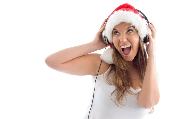 Modell mit Weihnachtsmütze und Kopfhörer — Stockfoto
