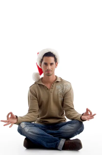 Handsome young man in meditating pose — Stock Photo, Image
