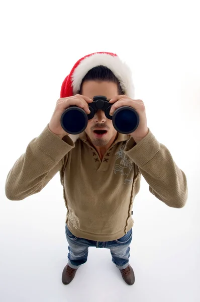 Young guy watching into binoculars — Stock Photo, Image