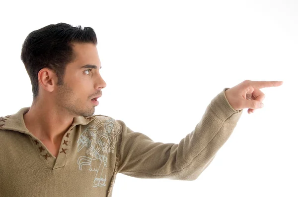 Fashionable man pointing sideways — Stock Photo, Image