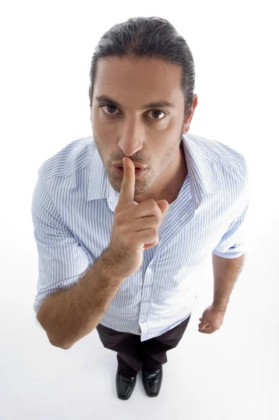 Man shushing with finger on his mouth — Stock Photo, Image