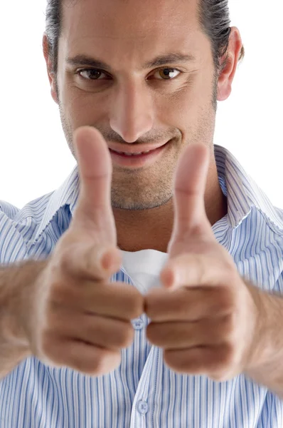 Smiling handsome guy pointing at camera — Stock Photo, Image