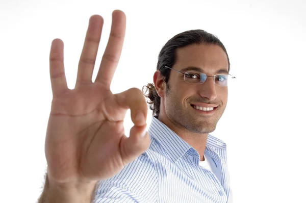 Young caucasian man with ok symbol — Stock Photo, Image