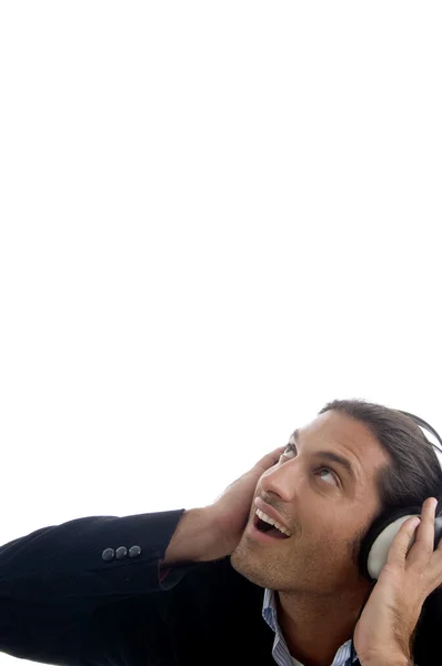 Jovem homem bonito com fones de ouvido — Fotografia de Stock