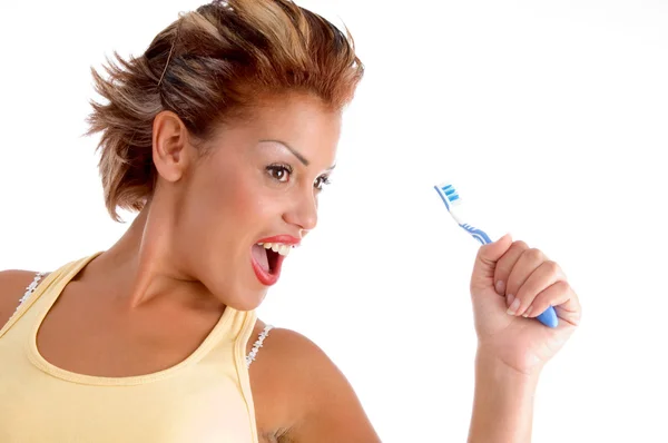 Jonge vrouw poseren met tandenborstel — Stockfoto