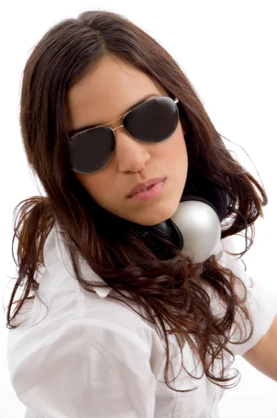 Young female listening music on headset — Stock Photo, Image