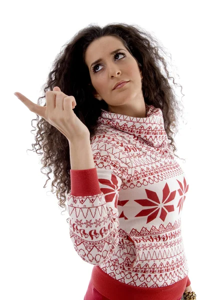 Pretty young woman pointing aside — Stock Photo, Image