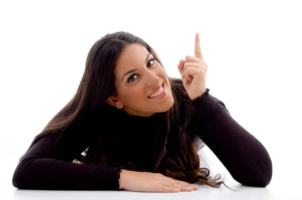 Pointing female looking at camera — Stock Photo, Image