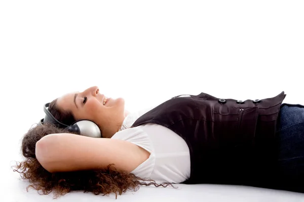 Young female tuned into music — Stock Photo, Image