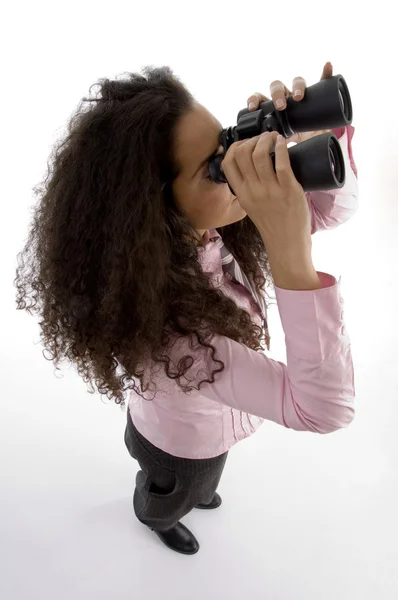Businesswoman looking through binoculars — Stock Photo, Image