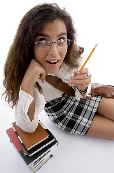 Młody student z książek i ołówek — Zdjęcie stockowe
