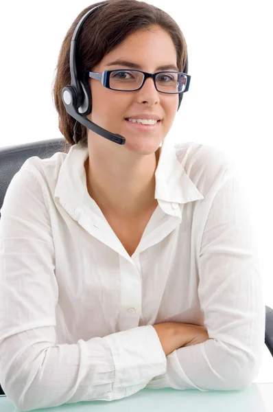 Woman with headset and folded hands — Stock Photo, Image