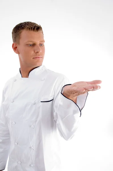 Guapo joven chef mirando su palma — Foto de Stock