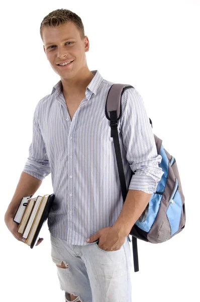 Student holding bag and books — Stock Photo, Image