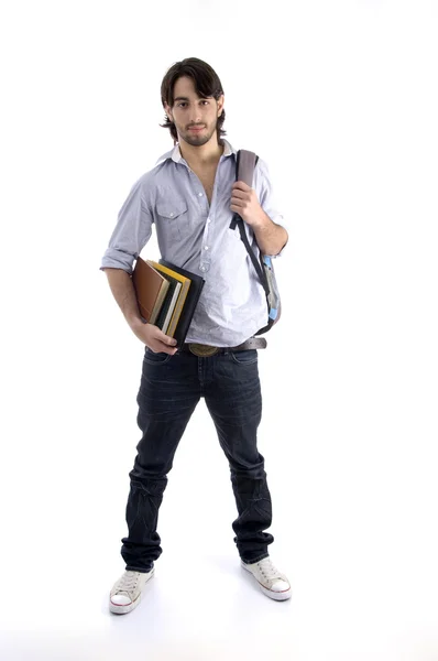 Estudante de pé com livros e saco — Fotografia de Stock