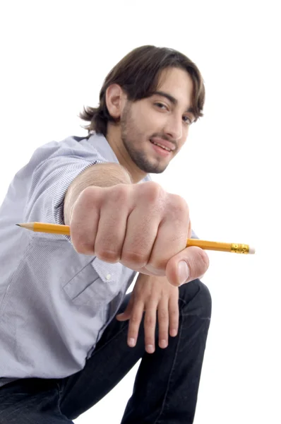 Bonito homem legal mostrando lápis — Fotografia de Stock