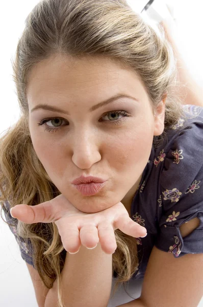 Gorgeous young beauty blowing kiss — Stock Photo, Image