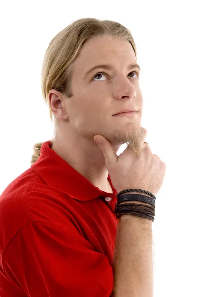 Smart young man thinking and looking up — Stock Photo, Image