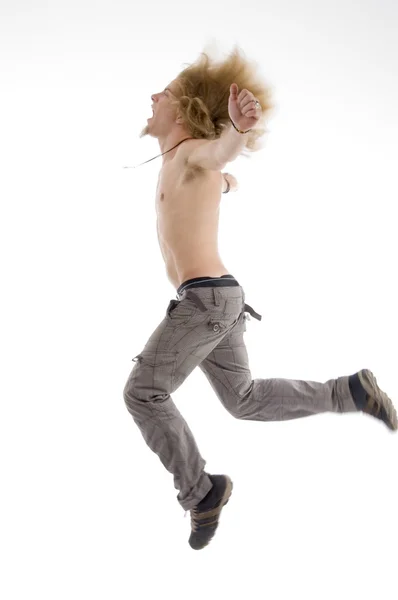 Seitenpose eines Mannes, der in die Luft springt — Stockfoto