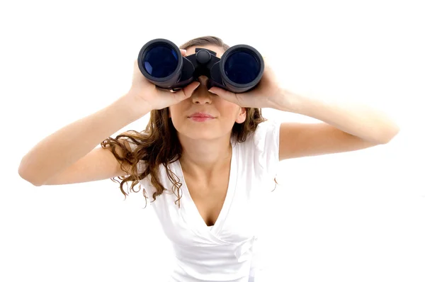 Female looking upward through binoculars — Stock Photo, Image