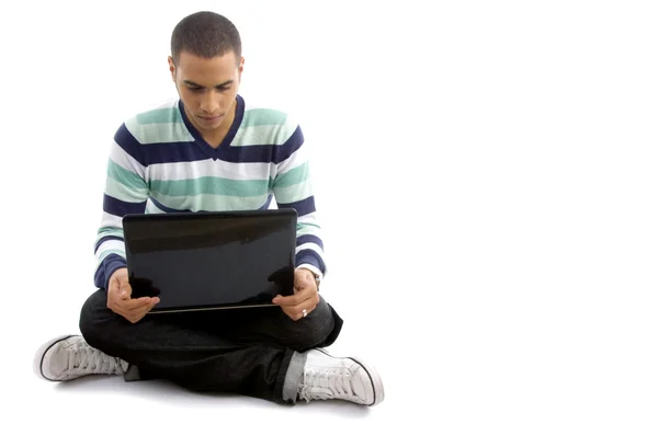 Casual pojke sitter med bärbar dator — Stockfoto