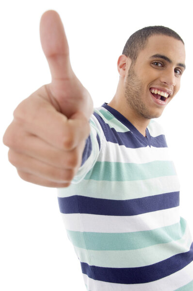 Cool young boy showing thumbs up