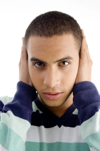 Handsome young guy with hands on ears — Stock Photo, Image