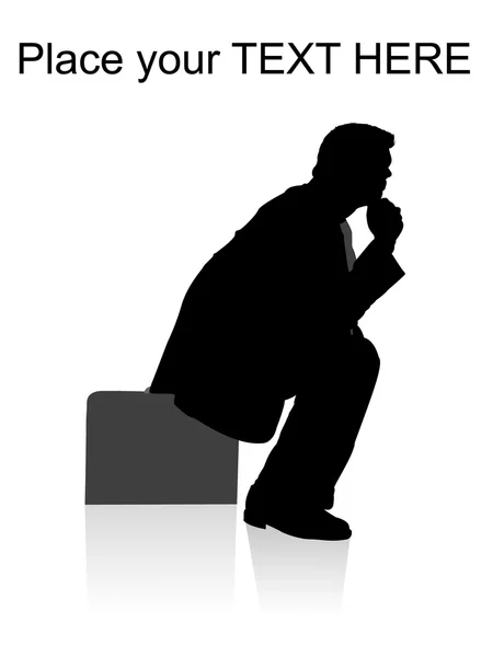 Silhouette of businessman sitting on bag — Stock Photo, Image
