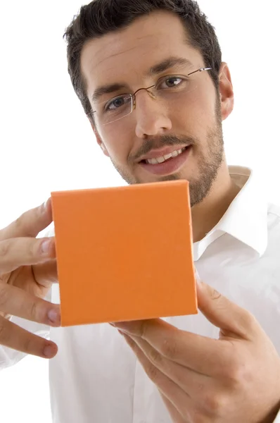 Young man showing jewellery box — Stock Photo, Image