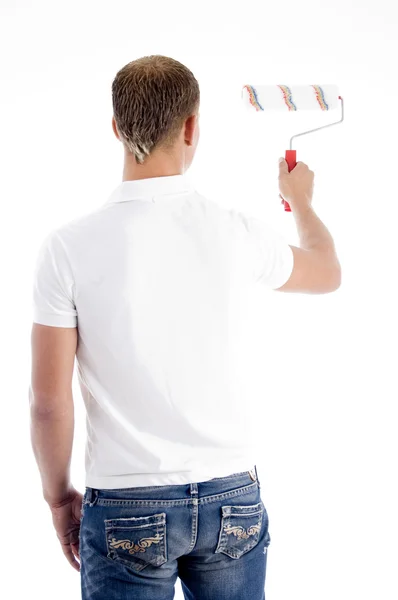 Back pose of stylish painter with roller — Stock Photo, Image