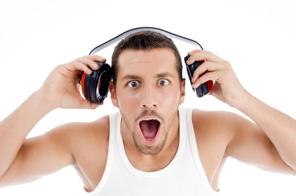 Espantado masculino ouvindo música — Fotografia de Stock