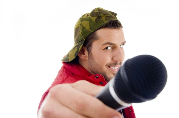 Male singer showing microphone — Stock Photo, Image
