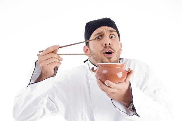 年轻厨师与碗和筷子 — 图库照片