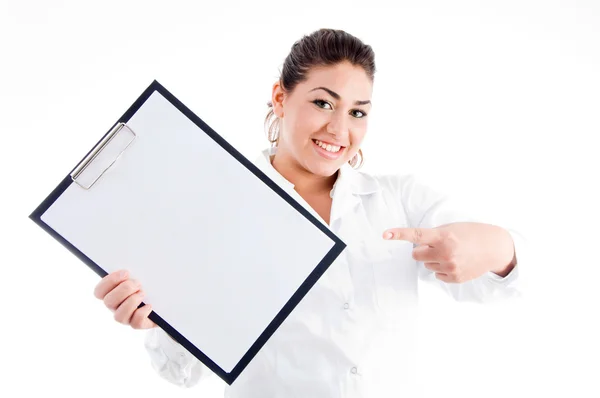 Portrait of doctor pointing at notepad — Stock Photo, Image