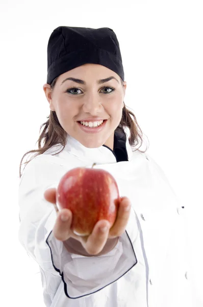 Köchin zeigt frischen Apfel — Stockfoto