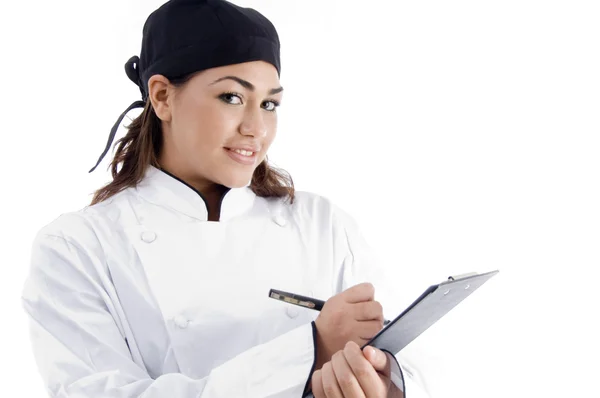 Close up de menu de escrita chef feminino — Fotografia de Stock