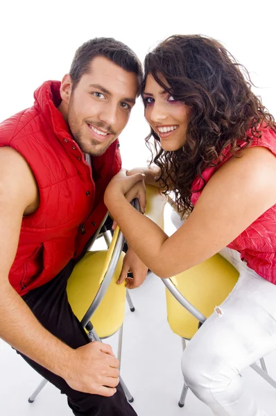 Young couple sitting on chair, relaxing — Stock Photo, Image