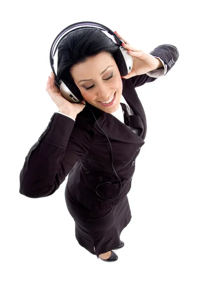 Young businesswoman holding headphone — Stock Photo, Image