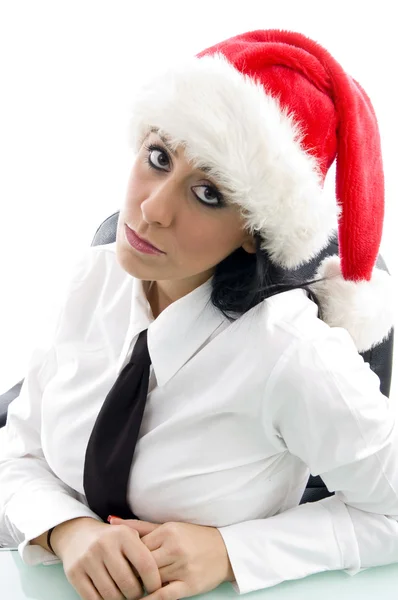 Young woman at work in christmas hat — Stock Photo, Image