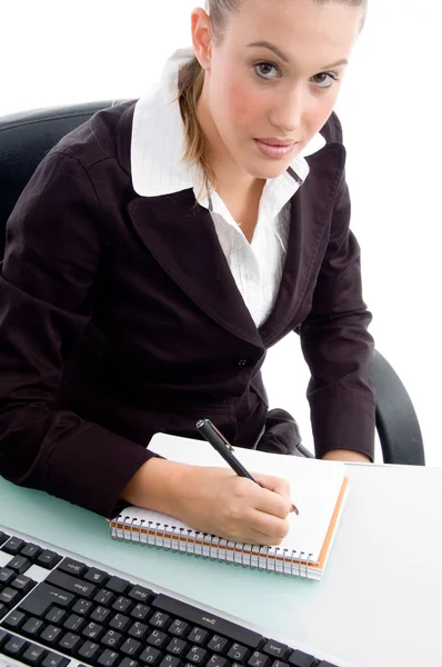 Young professional writing on notebook — Stock Photo, Image
