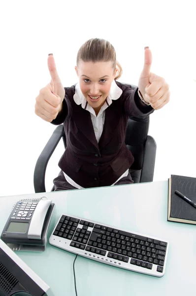 Young sitting woman with thumbs up — Stock Photo, Image