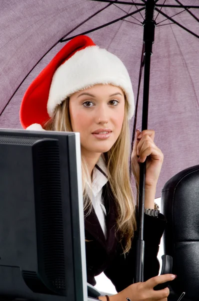 Professional woman wearing christmas hat — Stock Photo, Image