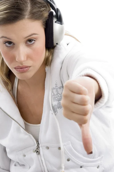 Young woman showing thumbs down — Stock Photo, Image