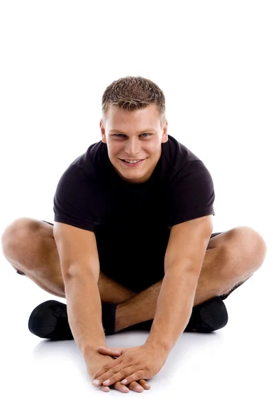 Estiramiento muscular masculino posando — Foto de Stock